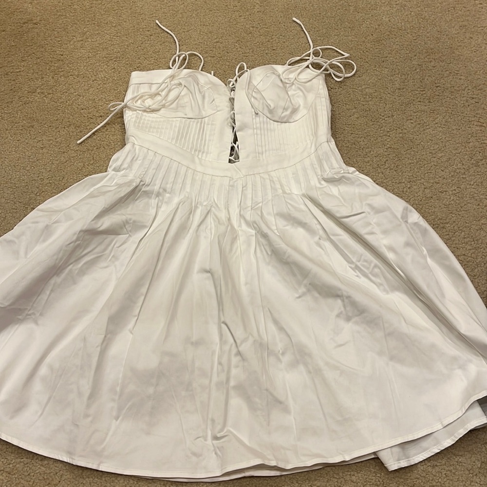 For love and lemons white dress new with tags. Size small. Bought final sale